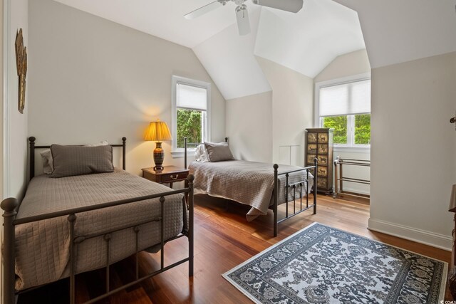 352 Old Carriage Loop, Georgetown, SC 29440 - bedroom featuring multiple windows, wood finished floors, lofted ceiling, ceiling fan, and baseboards