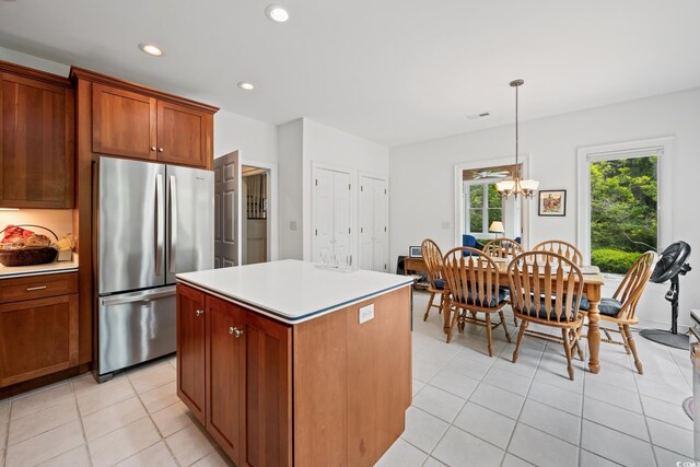 352 Old Carriage Loop, Georgetown, SC 29440 - kitchen with freestanding refrigerator, a chandelier, light countertops, light tile patterned floors, and a kitchen island