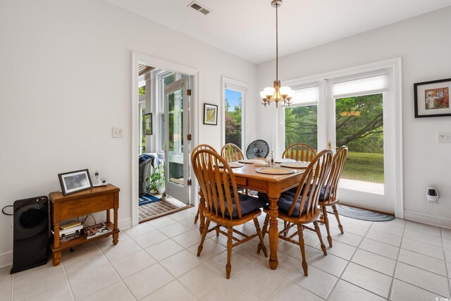 352 Old Carriage Loop, Georgetown, SC 29440 - dining area with a chandelier, baseboards, and light tile patterned flooring