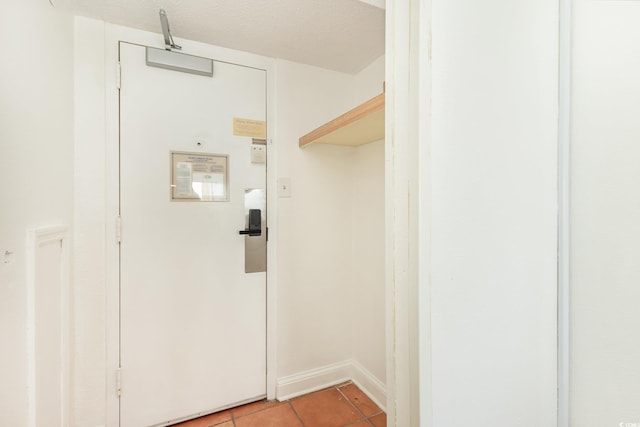 walk in closet featuring light tile patterned floors