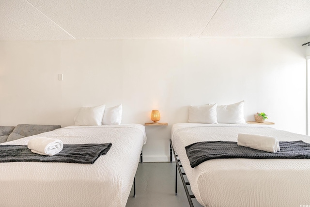 bedroom with concrete flooring