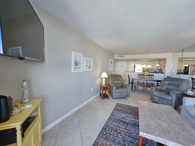 9820 Queensway Blvd Unit 1603, Myrtle Beach, SC 29572 - living area with light tile patterned flooring, baseboards, and a chandelier
