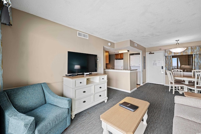 2701 N Ocean Blvd Unit 1260, Myrtle Beach, SC 29577 - living area with a textured ceiling, dark carpet, and baseboards