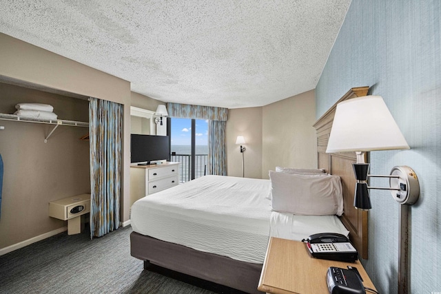 2701 N Ocean Blvd Unit 1260, Myrtle Beach, SC 29577 - bedroom with baseboards, a textured ceiling, a closet, and carpet flooring