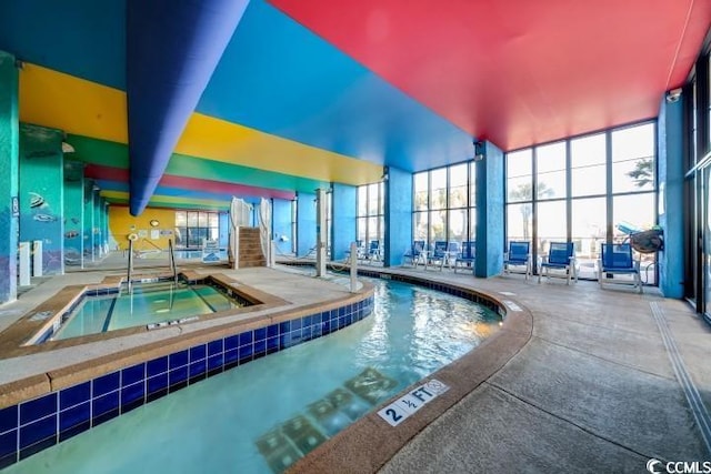 indoor pool with a hot tub