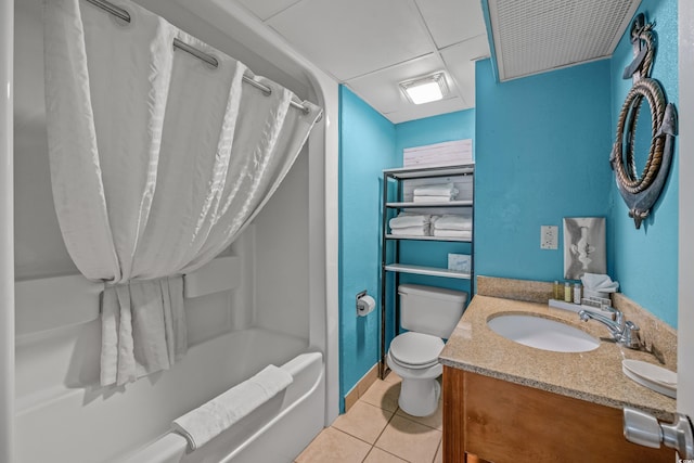 bathroom featuring tile patterned floors, toilet, vanity, shower / bath combo, and baseboards