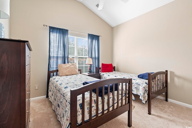 bedroom featuring light colored carpet, vaulted ceiling, baseboards, and ceiling fan