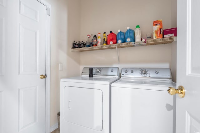 washroom with independent washer and dryer