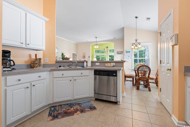 kitchen with dishwasher, a sink, a peninsula, and light tile patterned flooring