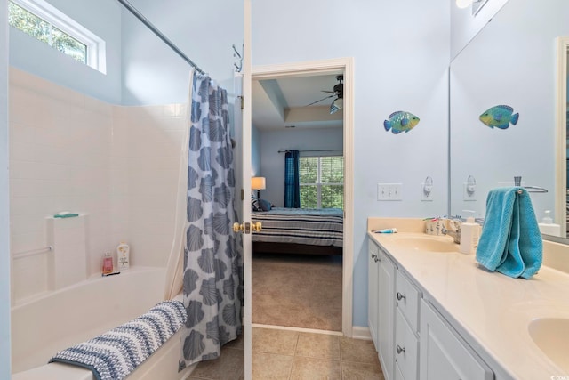 full bathroom with tile patterned flooring, healthy amount of natural light, ensuite bathroom, and shower / bath combo with shower curtain