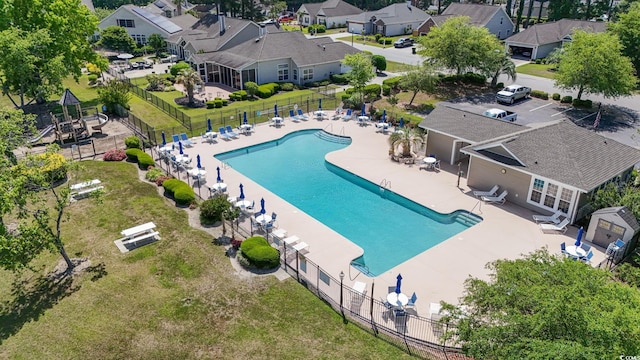 aerial perspective of suburban area featuring a pool