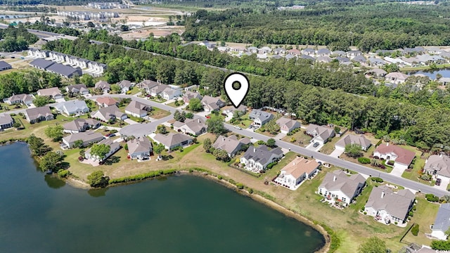 aerial overview of property's location with nearby suburban area and a large body of water