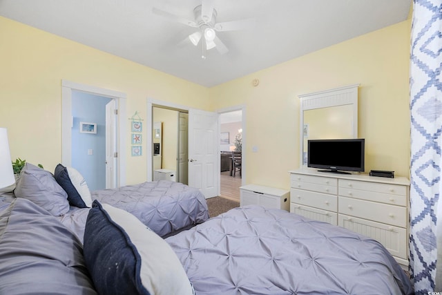 carpeted bedroom featuring a ceiling fan