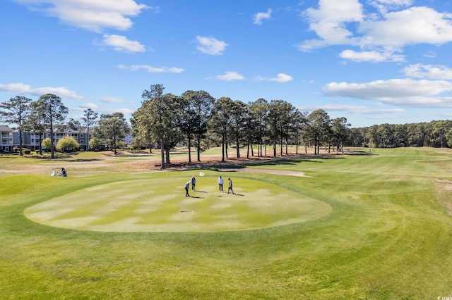 view of property's community featuring view of golf course