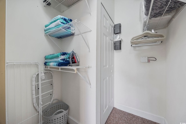 walk in closet featuring carpet