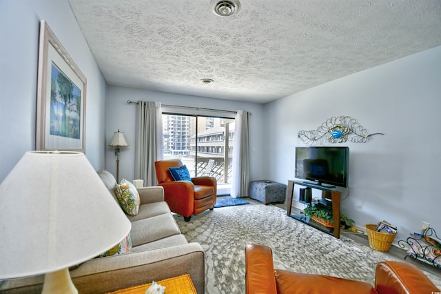 9621 Shore Dr Unit F-117, Myrtle Beach, SC 29572 - carpeted living room with a textured ceiling