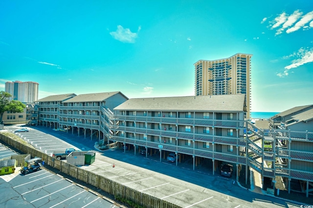 9621 Shore Dr Unit F-117, Myrtle Beach, SC 29572 - view of building exterior featuring uncovered parking