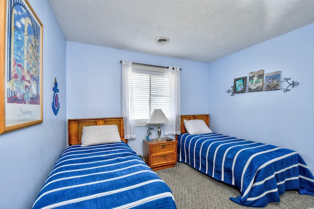 9621 Shore Dr Unit F-117, Myrtle Beach, SC 29572 - bedroom with carpet flooring and a textured ceiling