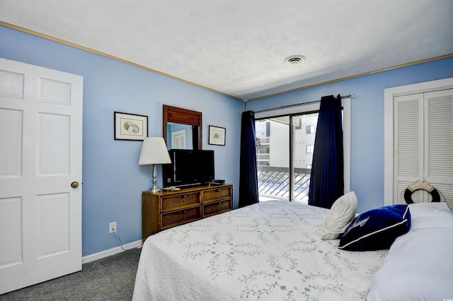 9621 Shore Dr Unit F-117, Myrtle Beach, SC 29572 - bedroom with carpet, ornamental molding, baseboards, a closet, and a textured ceiling