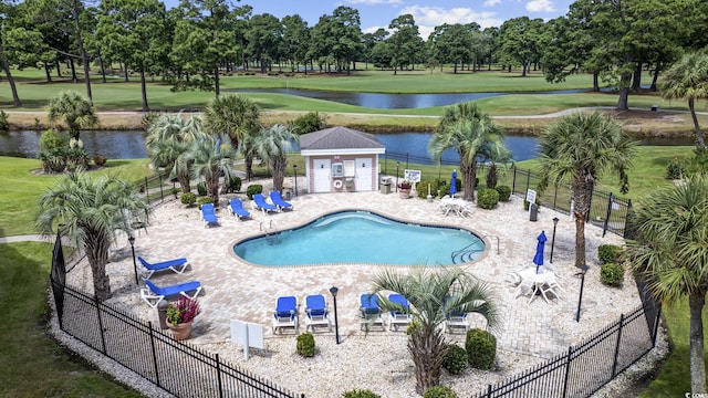 4828 Magnolia Lakes Dr Unit 404, Myrtle Beach, SC 29577 - community pool featuring a water view, golf course view, a patio area, and view of scattered trees