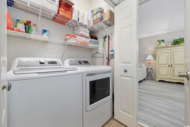 4828 Magnolia Lakes Dr Unit 404, Myrtle Beach, SC 29577 - laundry area with washer and dryer and light wood-style floors