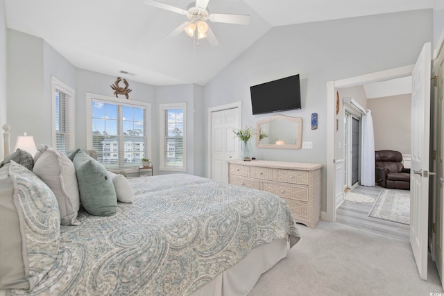 4828 Magnolia Lakes Dr Unit 404, Myrtle Beach, SC 29577 - bedroom featuring lofted ceiling, light carpet, a ceiling fan, and a closet