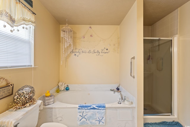 bathroom featuring a shower stall, a bath, and toilet