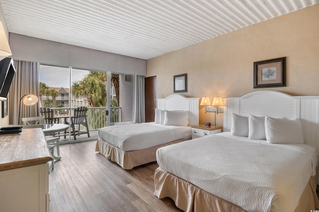 6803 N Ocean Blvd Unit 228, Myrtle Beach, SC 29572 - bedroom with access to outside and wood finished floors