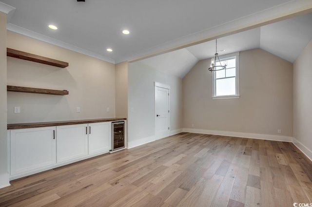 bonus room featuring wine cooler, light wood-style flooring, baseboards, vaulted ceiling, and recessed lighting
