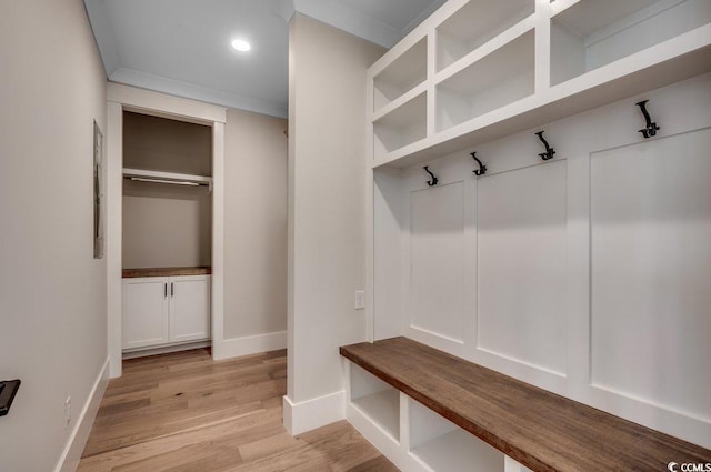 mudroom featuring light wood-type flooring, baseboards, and recessed lighting