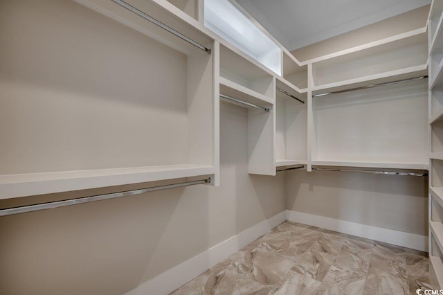spacious closet with light marble finish flooring