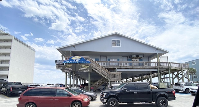 view of front of property featuring stairway