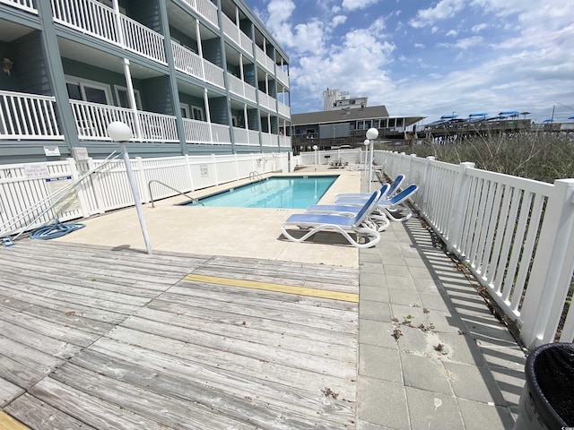 community pool with a deck