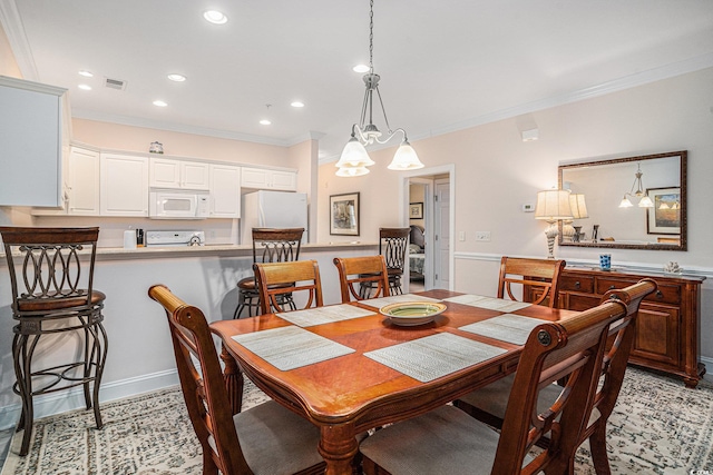 dining area with ornamental molding, recessed lighting, and a chandelier