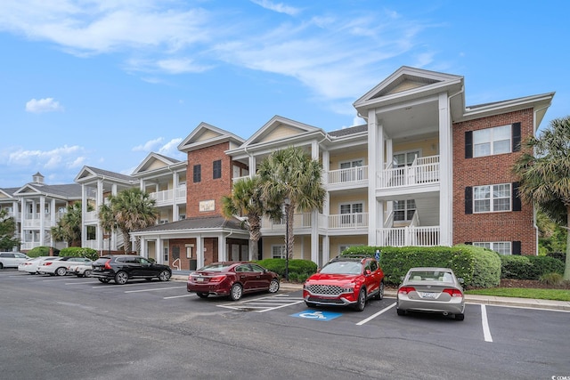 view of property with uncovered parking