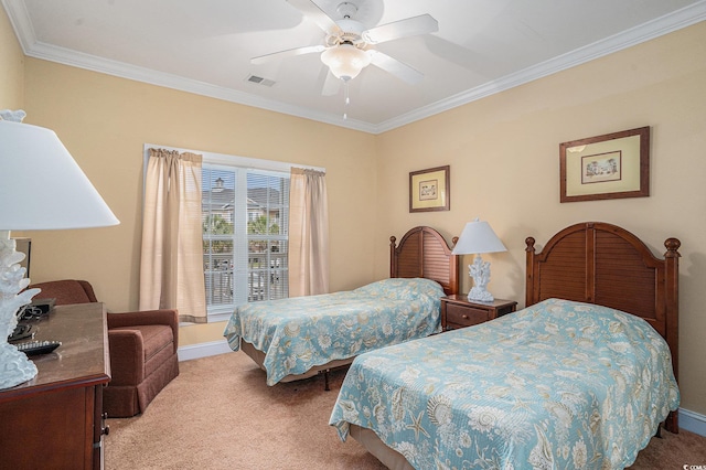bedroom featuring carpet flooring, crown molding, a ceiling fan, and baseboards