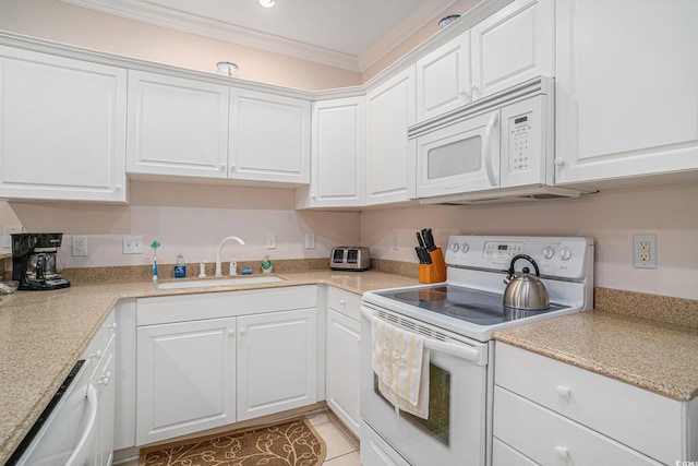 kitchen featuring white appliances, a sink, white cabinetry, crown molding, and light countertops