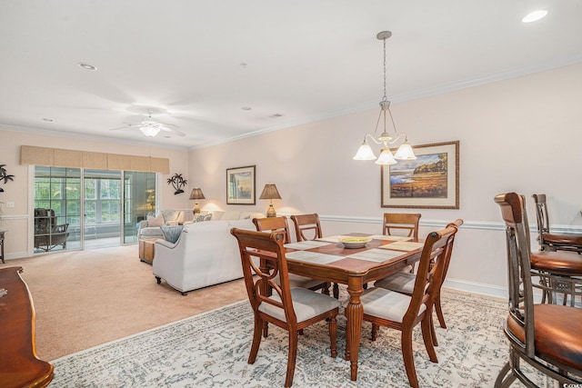 dining room with a chandelier, ornamental molding, ceiling fan, light carpet, and recessed lighting