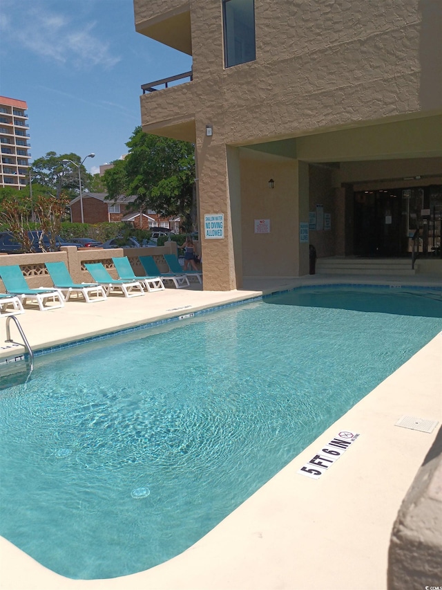 210 75th Ave N Unit 4042, Myrtle Beach, SC 29572 - community pool with a patio area