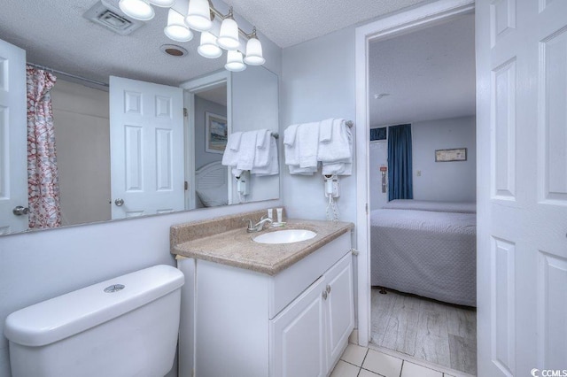 210 75th Ave N Unit 4042, Myrtle Beach, SC 29572 - full bath with ensuite bath, vanity, toilet, and a textured ceiling