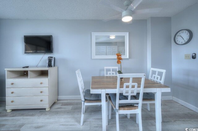 210 75th Ave N Unit 4042, Myrtle Beach, SC 29572 - dining room with wood finished floors, ceiling fan, baseboards, and a textured ceiling