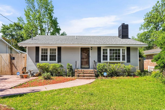 719 Juniper Dr, Myrtle Beach, SC 29575 - view of front of property with a chimney, entry steps, and roof with shingles