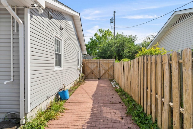 719 Juniper Dr, Myrtle Beach, SC 29575 - view of side of home featuring fence and a gate