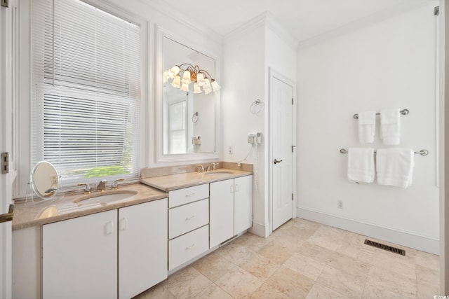 bathroom featuring ornamental molding, double vanity, and baseboards