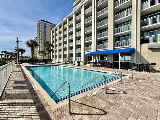 5300 N Ocean Blvd Unit 1102, Myrtle Beach, SC 29577 - half bath with wood finished floors, vanity, toilet, and baseboards