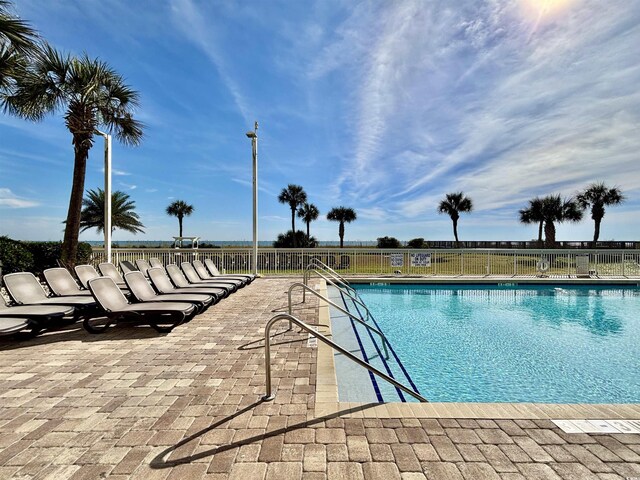 5300 N Ocean Blvd Unit 1102, Myrtle Beach, SC 29577 - bathroom featuring wood finished floors, shower / bath combo with shower curtain, toilet, baseboards, and vanity