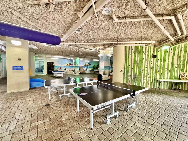 5300 N Ocean Blvd Unit 1102, Myrtle Beach, SC 29577 - living room with a textured ceiling, wood finished floors, a water view, and a wall of windows