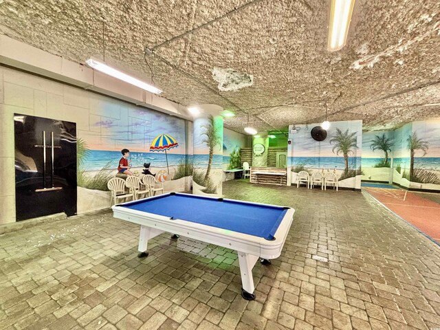 5300 N Ocean Blvd Unit 1102, Myrtle Beach, SC 29577 - living area with wood finished floors, a textured ceiling, a water view, and expansive windows