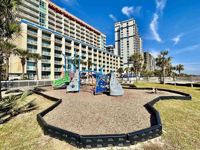 5300 N Ocean Blvd Unit 1102, Myrtle Beach, SC 29577 - living area featuring a textured ceiling, light wood-style flooring, and expansive windows