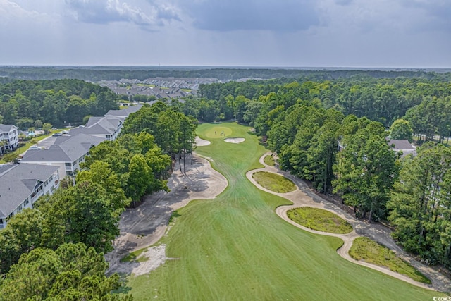 aerial overview of property's location featuring a local golf course and nearby suburban area